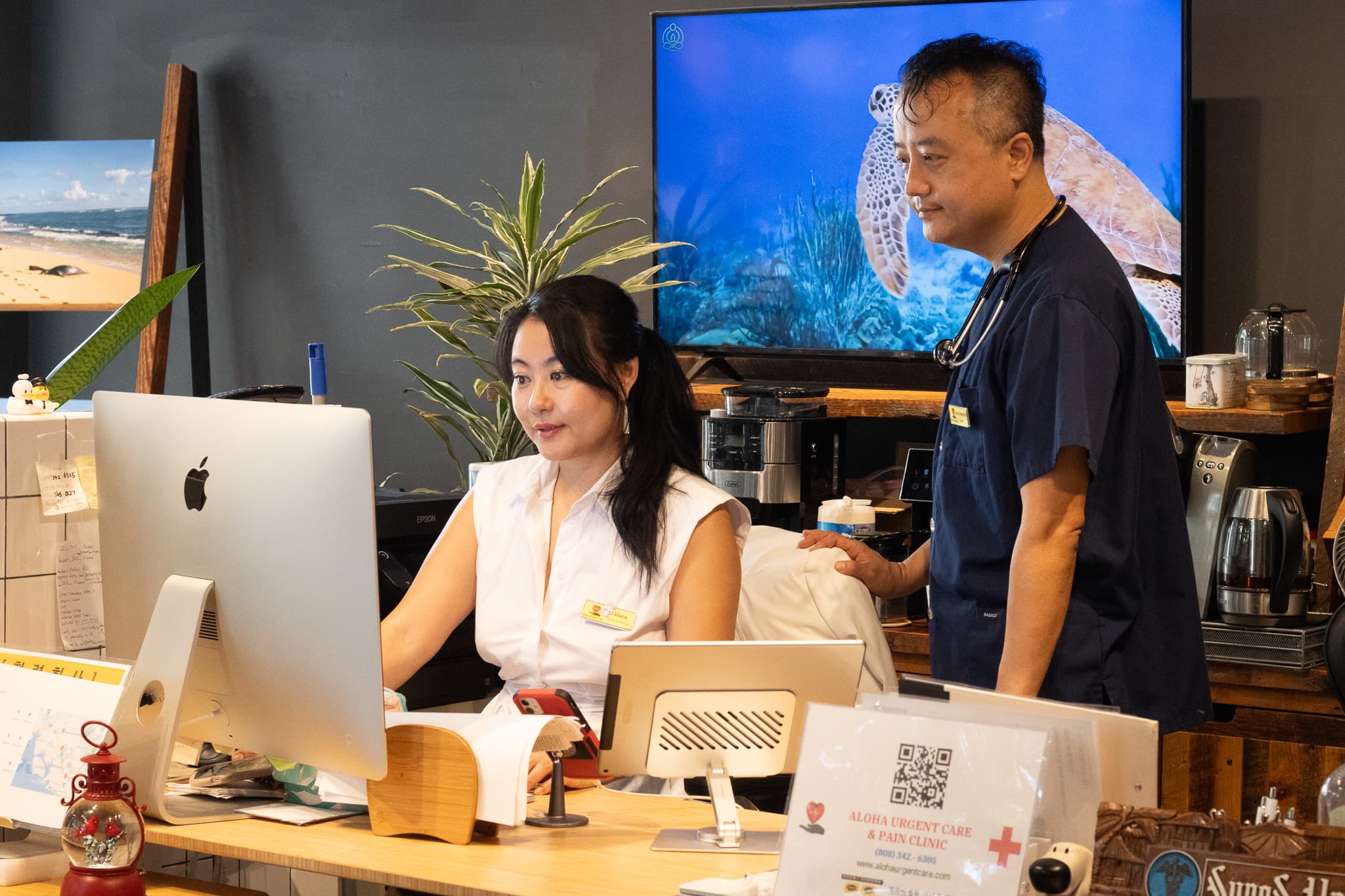 Dr. Yang and staff at the Aloha Urgent Care & Pain Clinic front desk