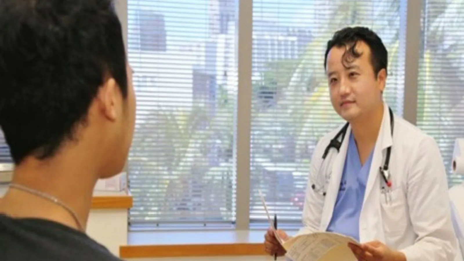 Doctor consulting with patient - physician-led care